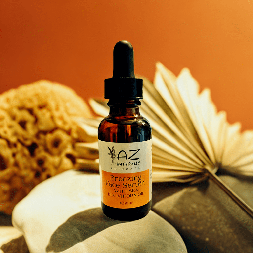 Amber dropper bottle of 'Bronzing Face Serum with Sea Buckthorn Oil' on top of rocks with an orange background 