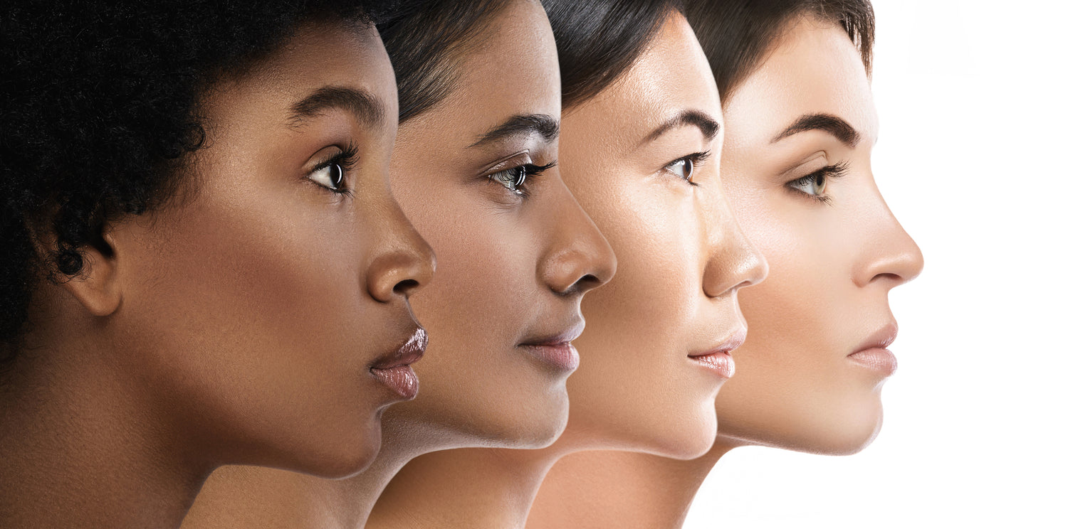 Side profile of four diverse women with different skin tones aligned in a row