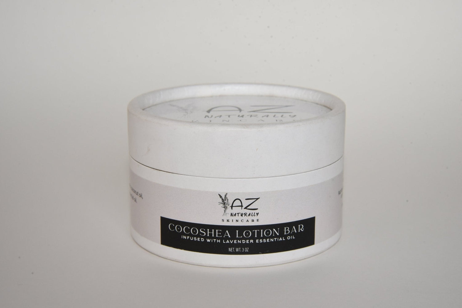 Jar of 'Handcrafted Cocoshea Lotion Bar' on a light gray background 