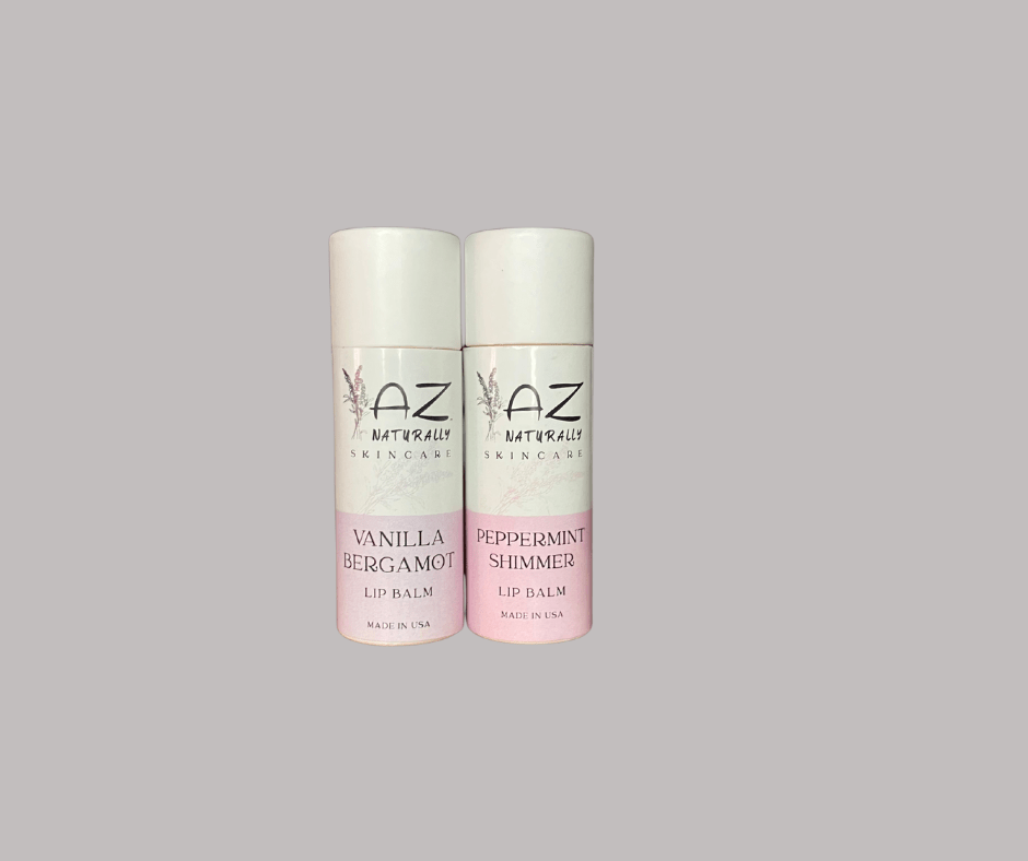 Two bottles of 'Plant-based Lip Balm' labeled 'Vanilla Bergamot' and 'Peppermint Shimmer' on a light gray background