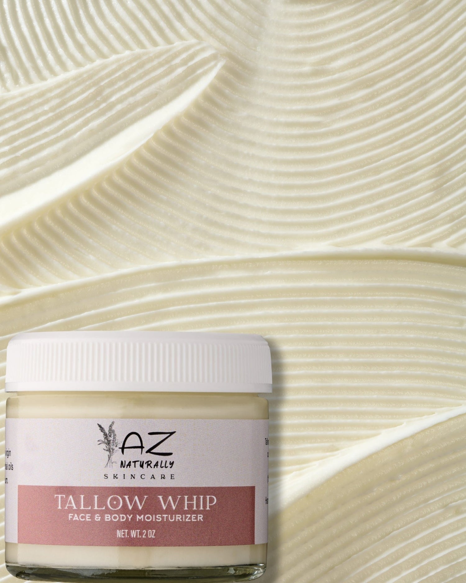 Jar of 'Tallow Whip Face & Body Moisturizer' with a background of sand